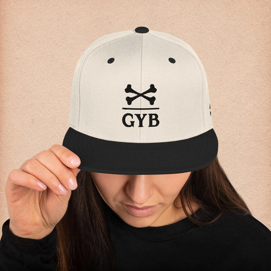 Black and White Snapback Hat with "Gather Your Bones" crossbones logo