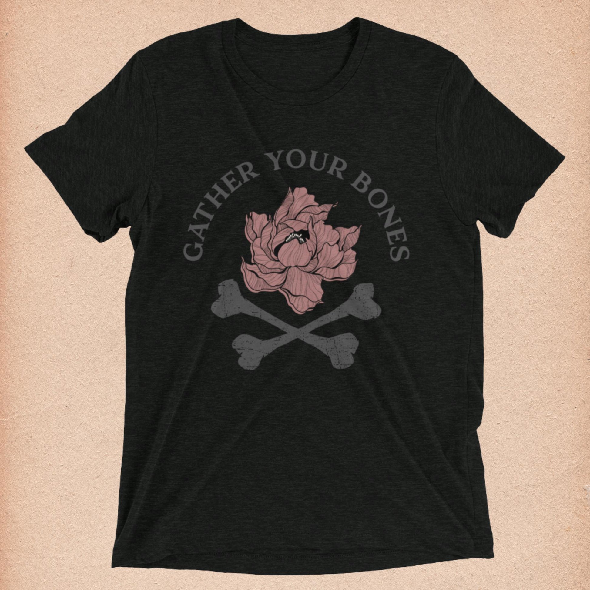 Charcoal Black Short-Sleeved T-Shirt with "Gather Your Bones" peony and crossbones logo